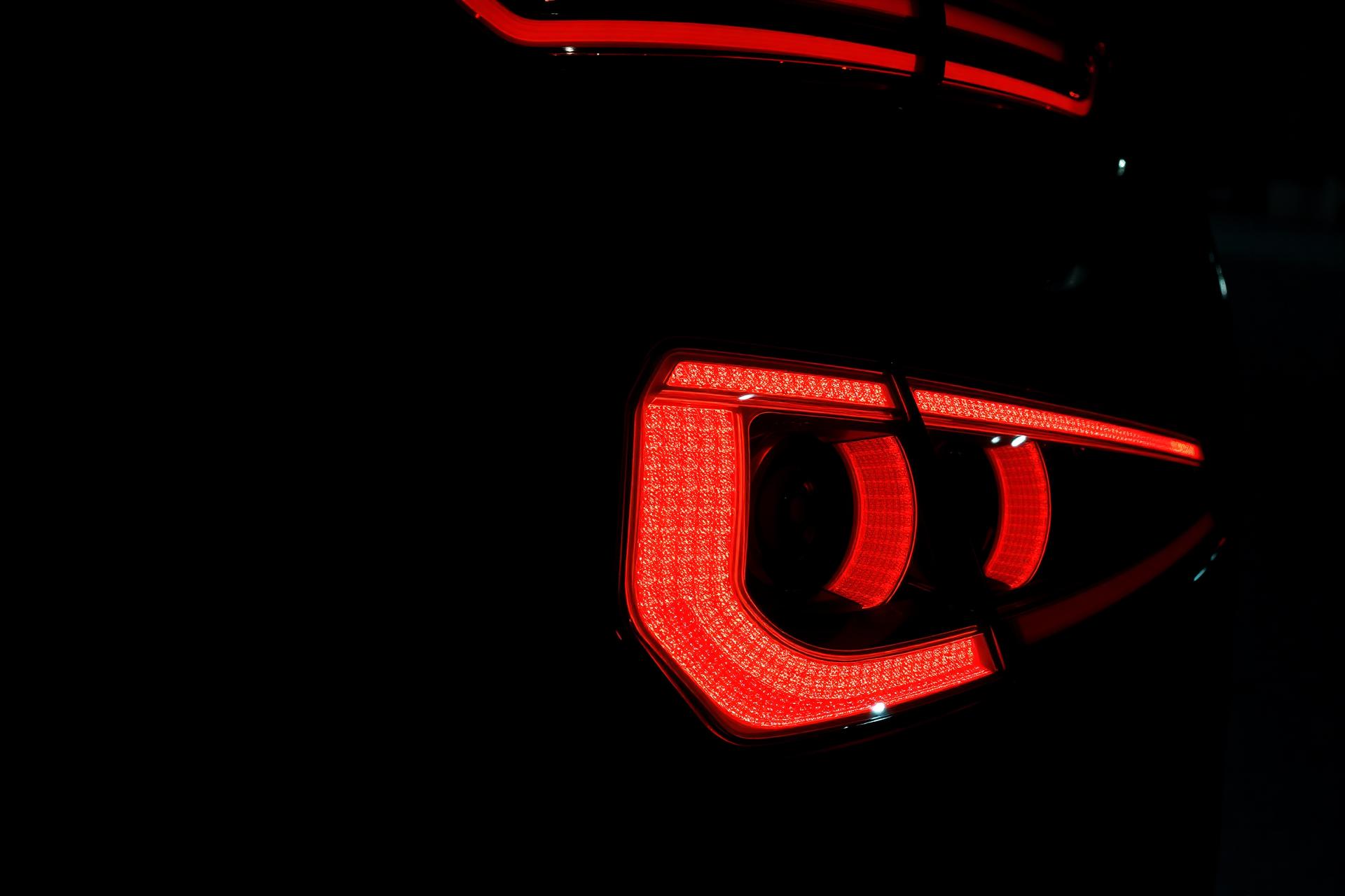 Glowing LED tail light of a US car at night